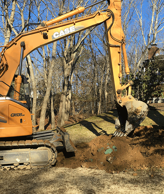 Backhoe Starts to Dig