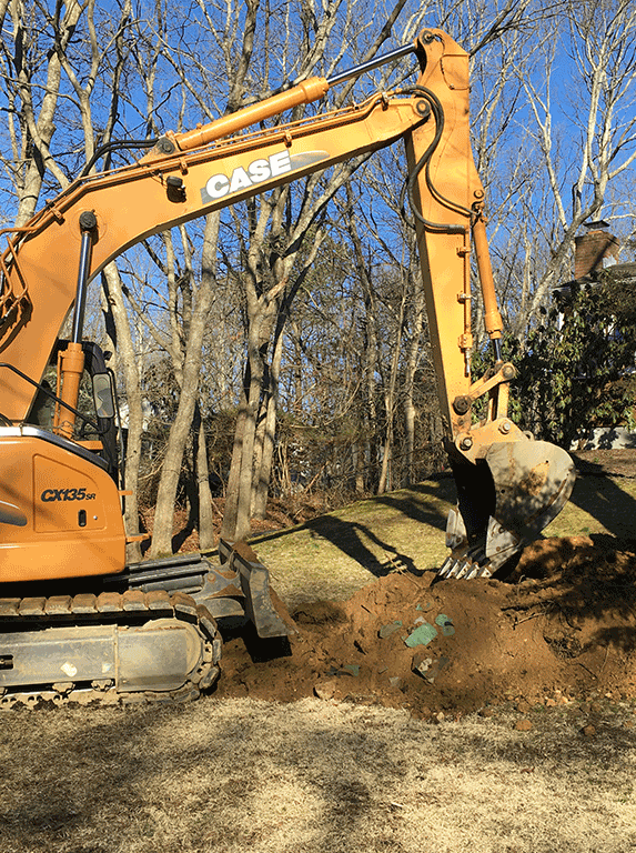 Backhoe Starts to Dig